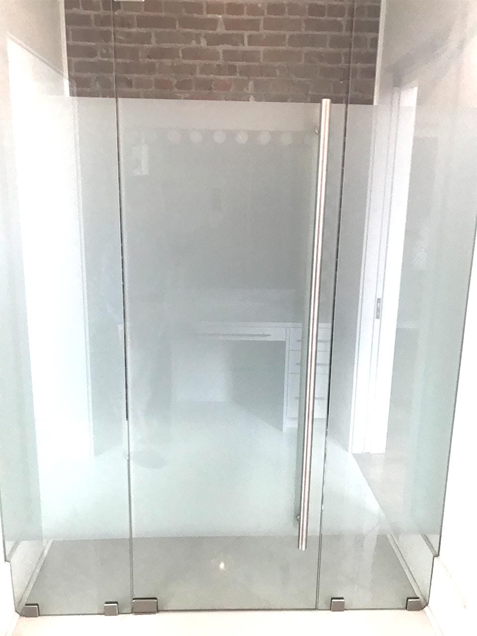 Frosted glass shower door installed by Reliable Glass & Mirror
