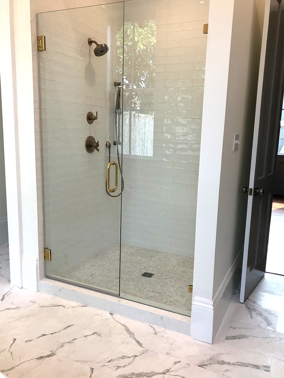 Glass shower enclosure installed by Reliable Glass & Mirror