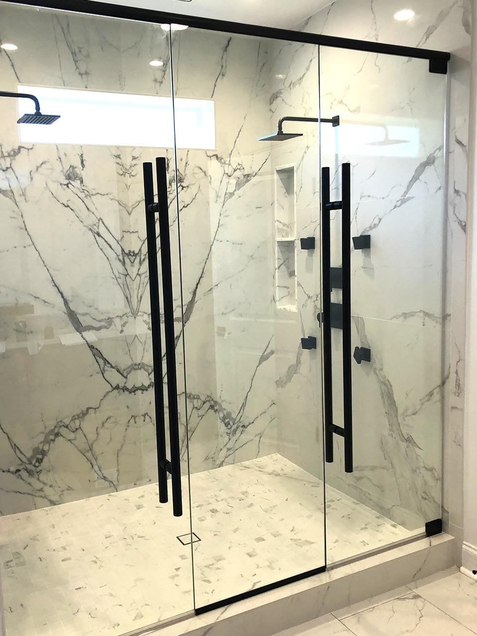 Shower door handles installed by Reliable Glass & Mirror