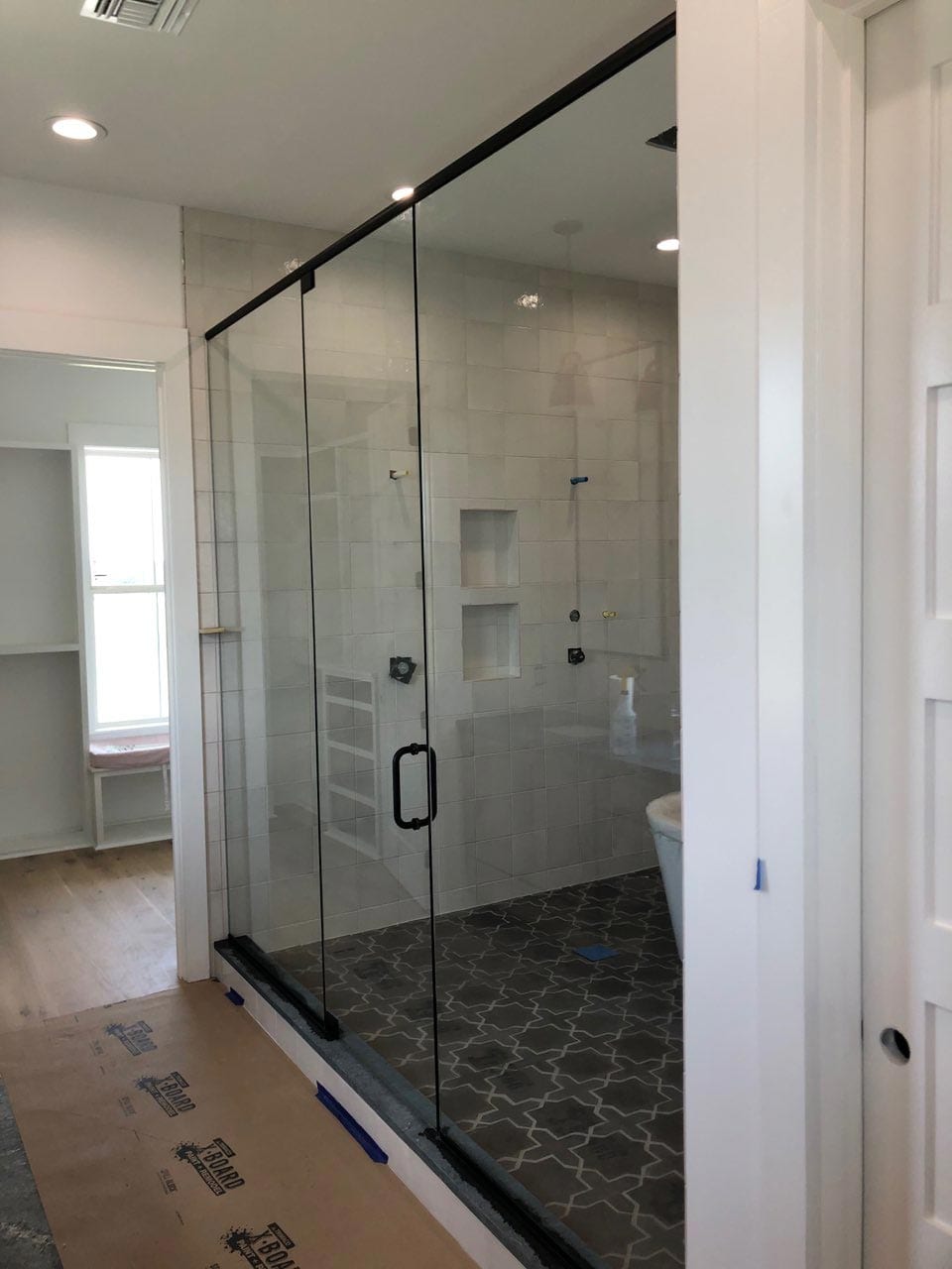 Tub and shower enclosure installed by Reliable Glass & Mirror